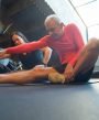 Couple sitting on the floor stretching